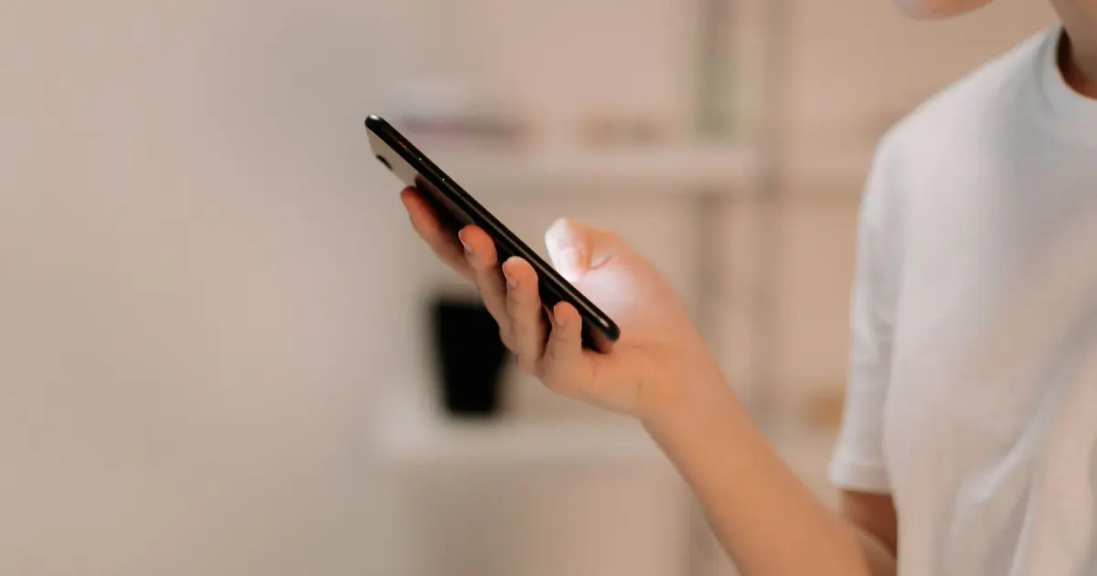 Person configuring a smartphone during an iPhone eSIM setup